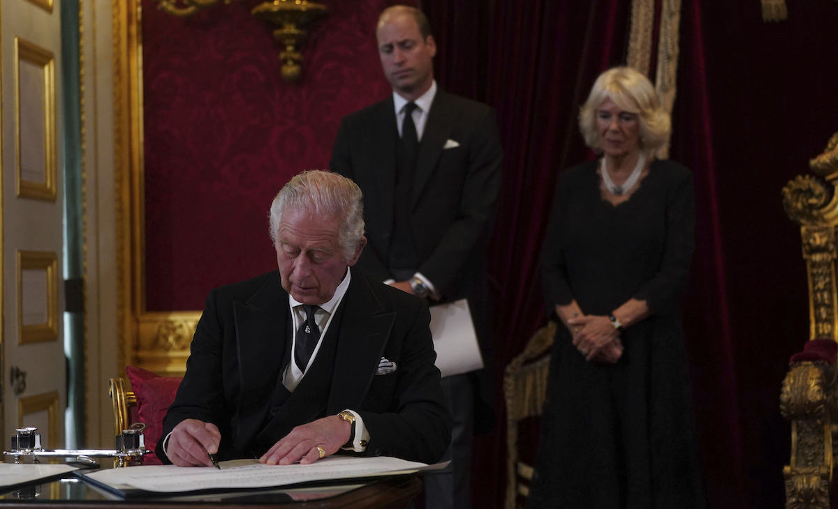 King Charles III signs an oath to uphold the security of the Church in Scotland on Sept. 10, 2022