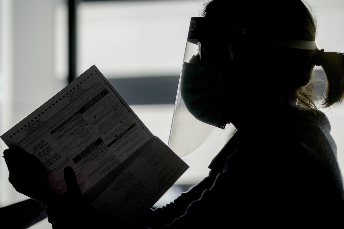Election worker with face shield Milwaukee 11-3-20