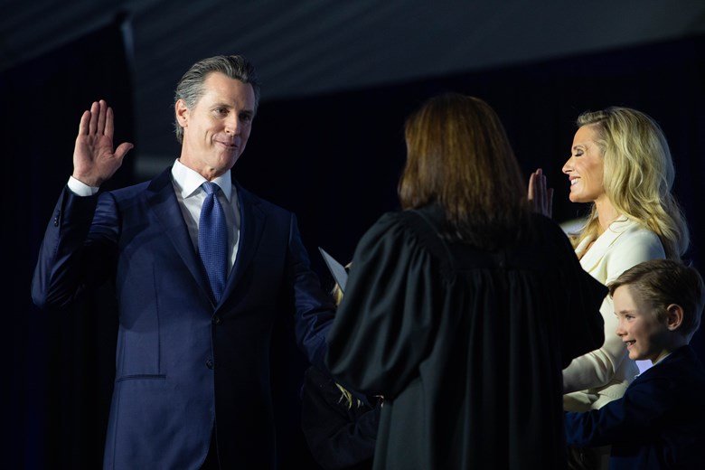 Gavin Newsom inauguration hand raised