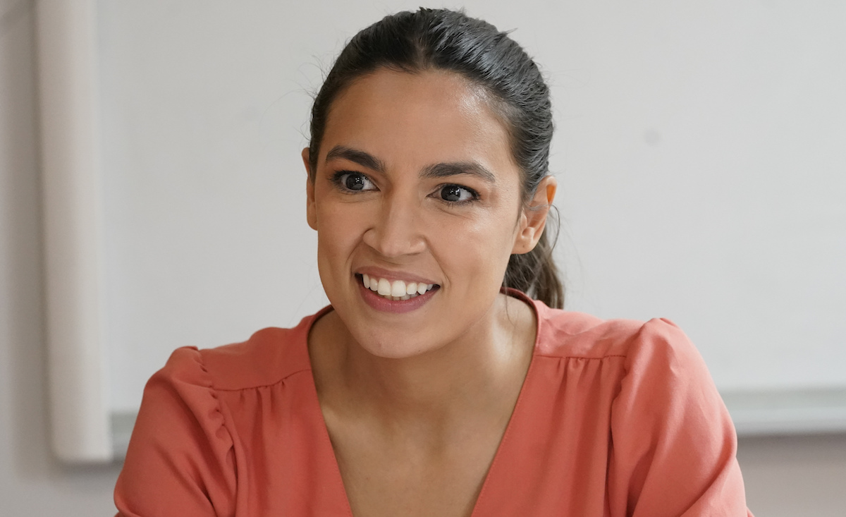 Rep. Alexandria Ocasio-Cortez, D-N.Y., sits at a meeting at the Chhaya Community Development Corporation, July 6, 2022. (AP)