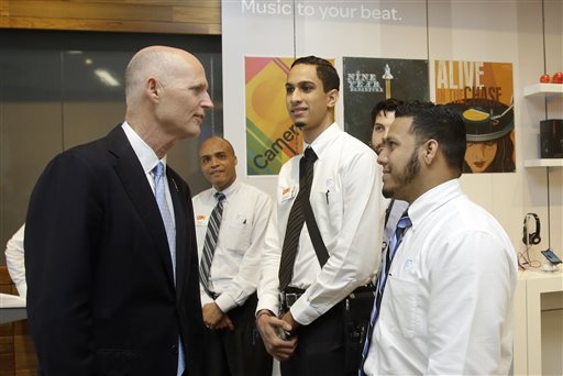 Rick Scott at a Miami business 2013