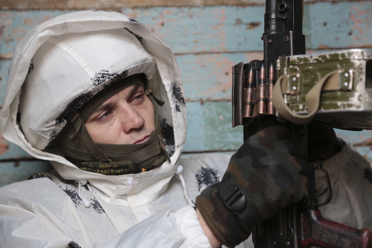 Ukrainian soldier with machine gun