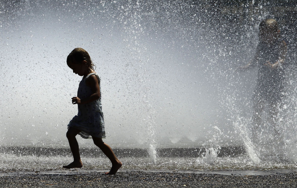 Kid in water fountain, 7-31-2015