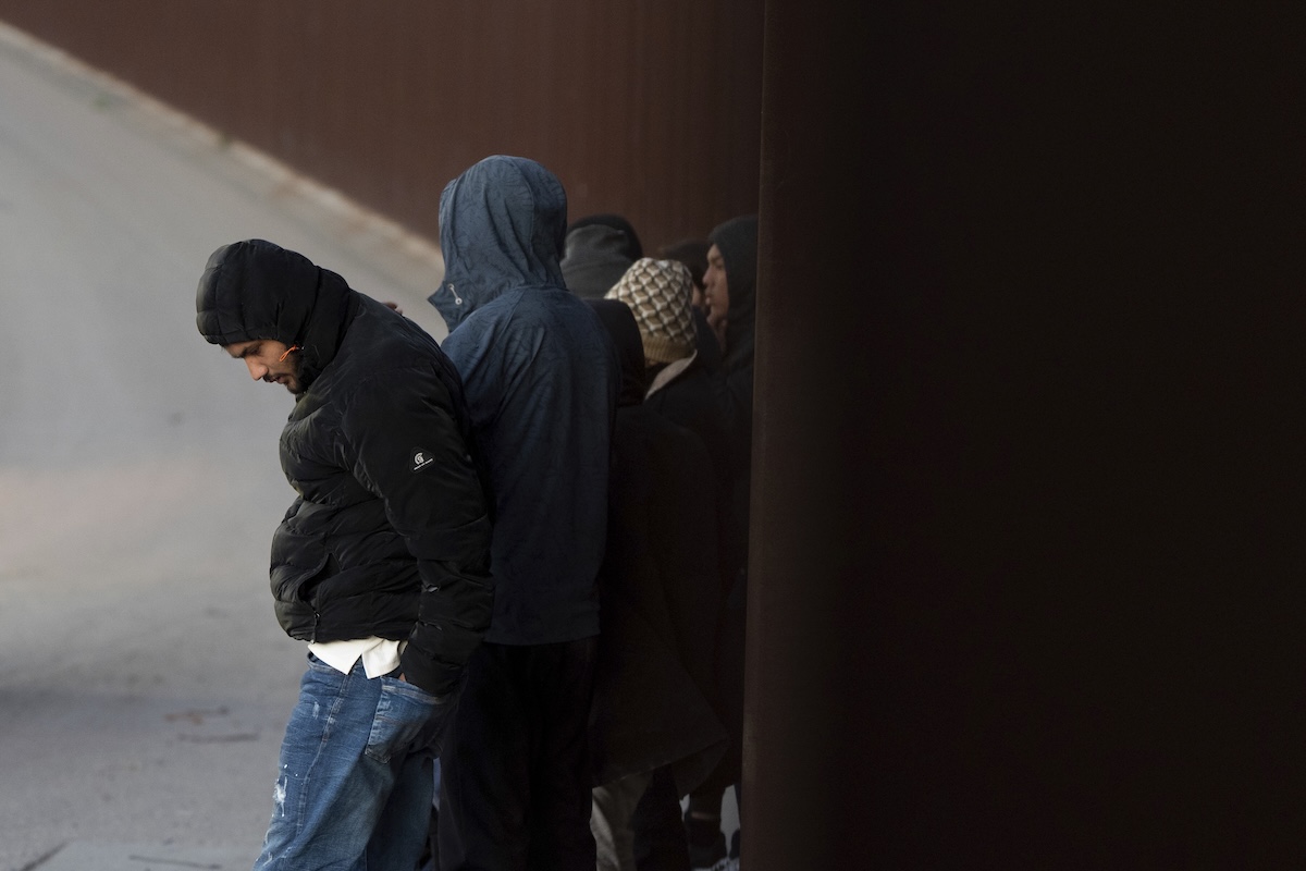 Migrants by the wall 01-21-2025