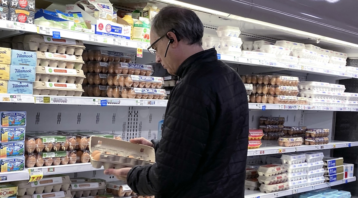 Man buys eggs at grocery story 2023