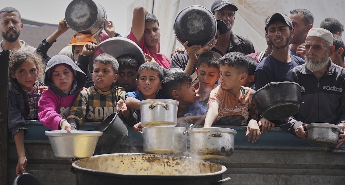 Palestinian children waiting for food in Gaza Strip April 2025