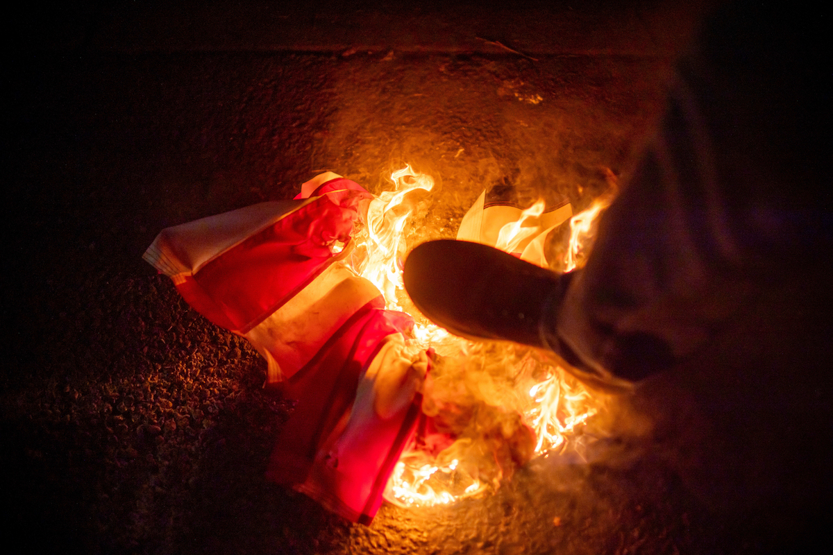 Protesters burning U.S. flag Portland