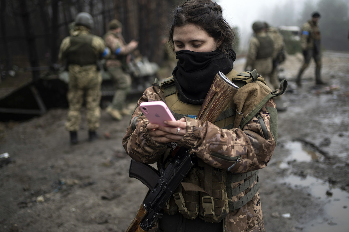 Ukrainian solider holding pink phone
