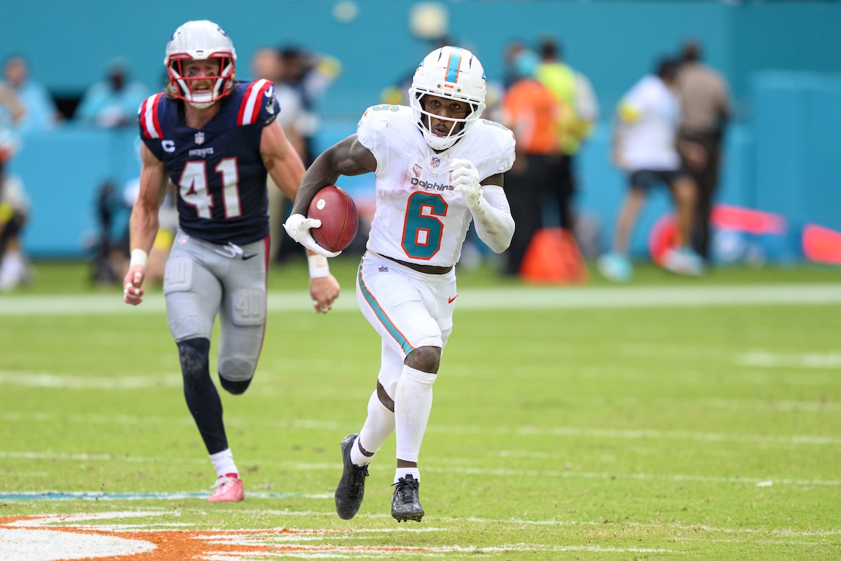 Dolphins wide receiver Malik Washington runs with ball returning kickoff for at touchdown Sept. 14, 2025