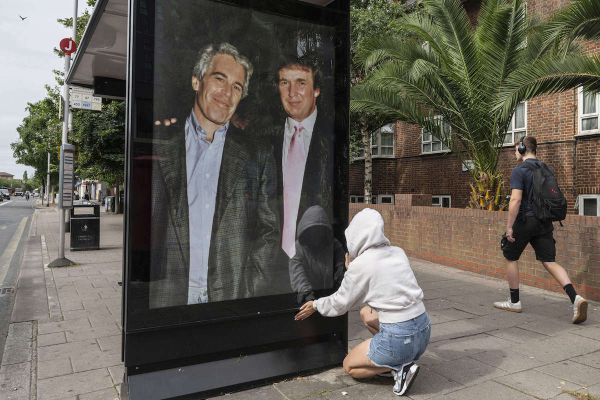 Trump and Epstein photo on bus shelter 7-17-25