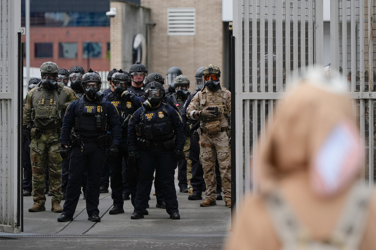 Fed law enforcement outside ICE facility in portland 2025
