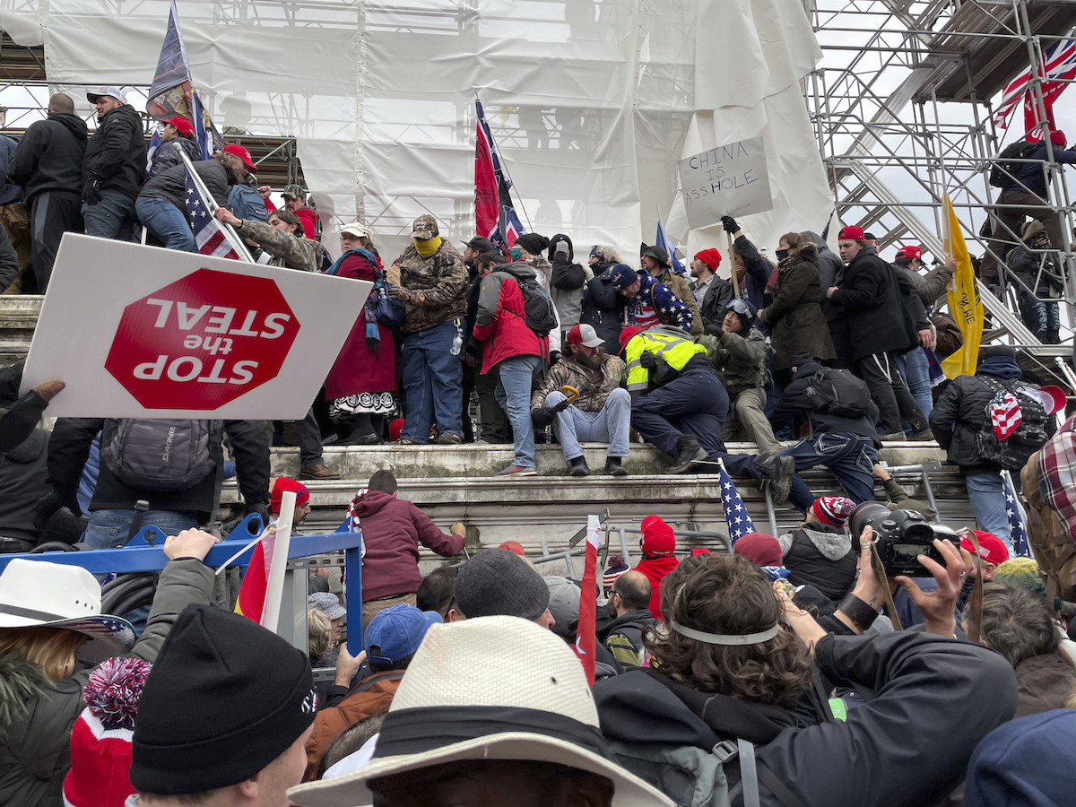 Jan. 6 mob Stop the steal sign upside down