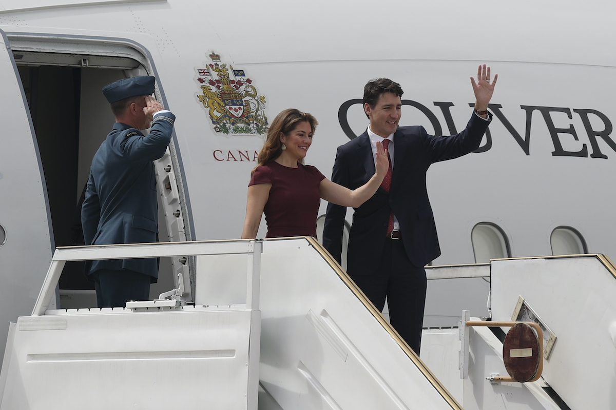 Canada's Prime Minister Justin Trudeau and wife Sophie Grégoire-Trudeau wave after arriving at the G20 Summit in Buenos Aires, Argentina, Nov. 29, 2018 (AP)