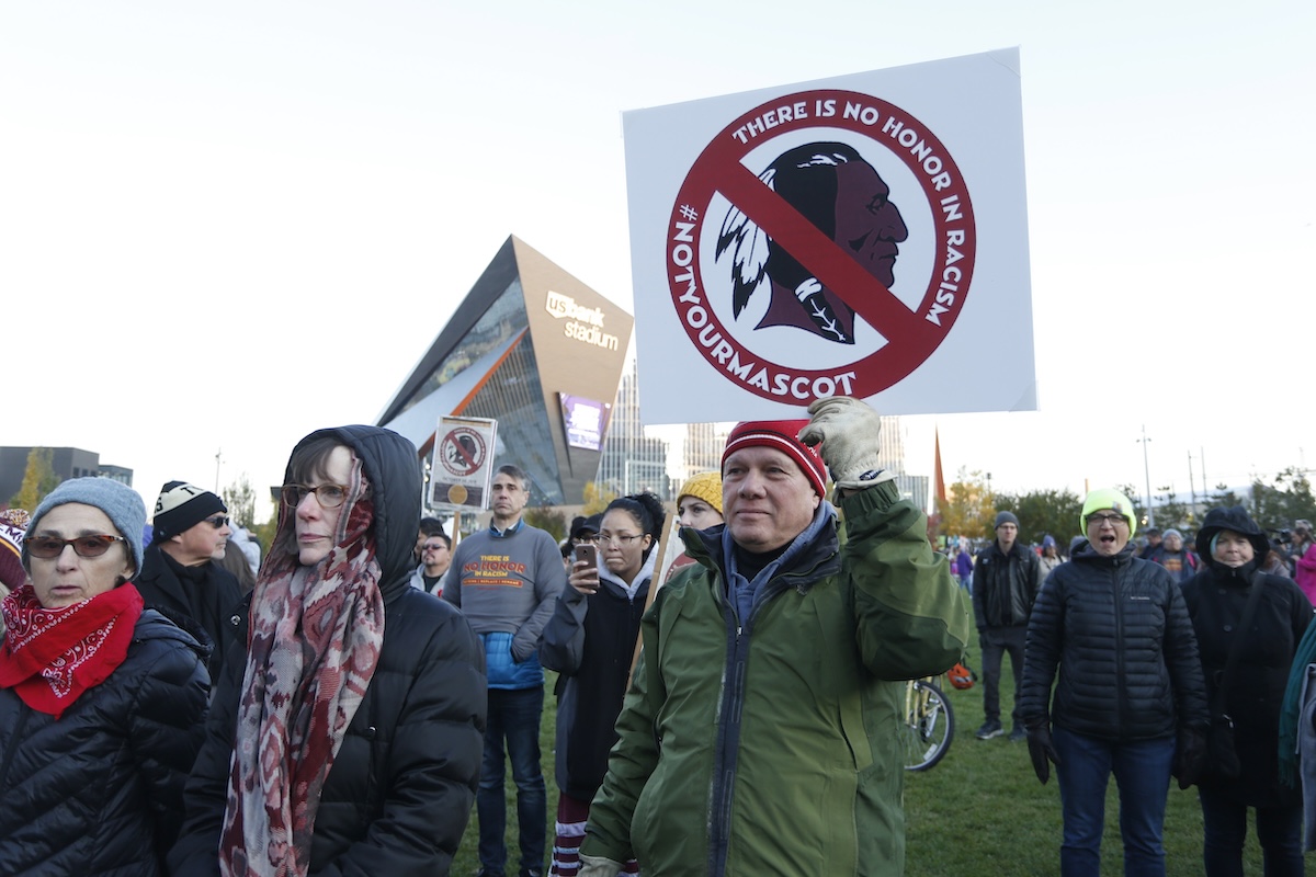 Native American leaders protest against the Redskins team name and logo before an NFL football game 10-24-2019