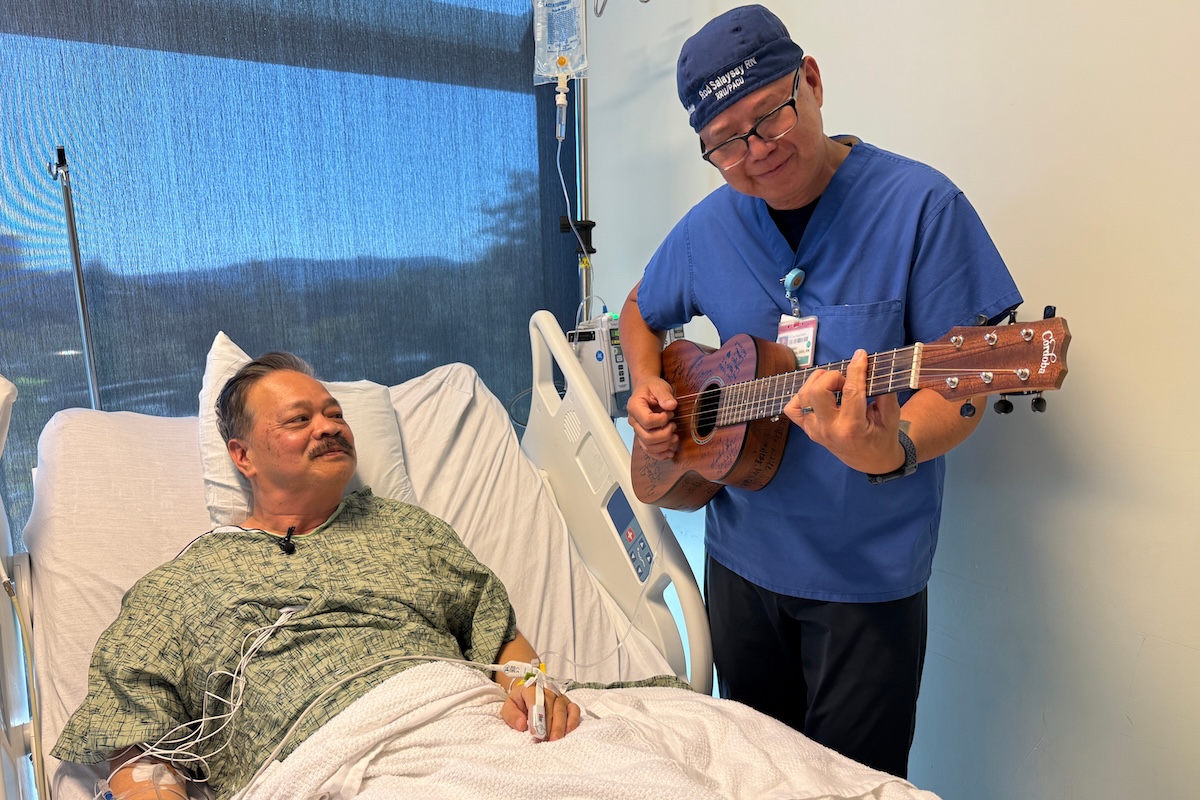 Nurse Rod Salaysay plays guitar for a recovering patient 09-30-2025