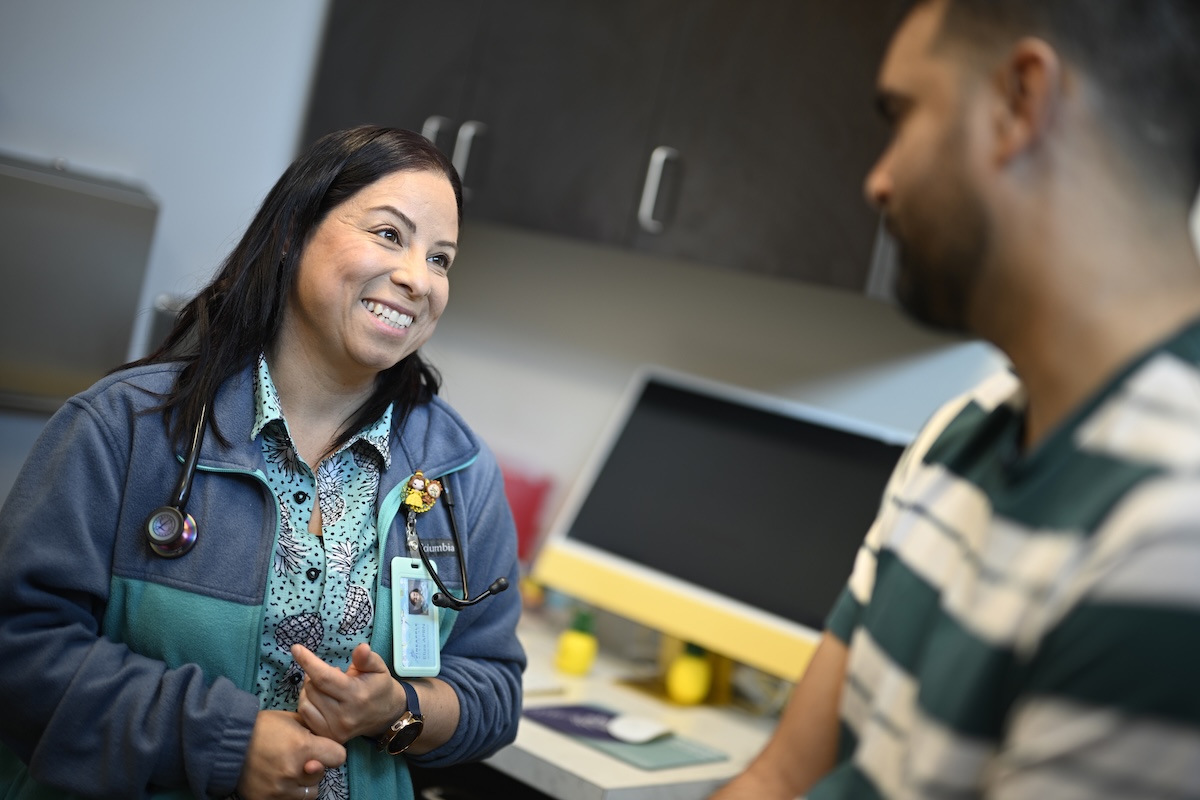 Nurse practitioner Eliza Otero, left, talks with patient 05-28-2024