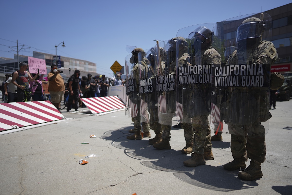 Protesters confront U.S. National Guard in LA following immigration raid protest 06-08-2025
