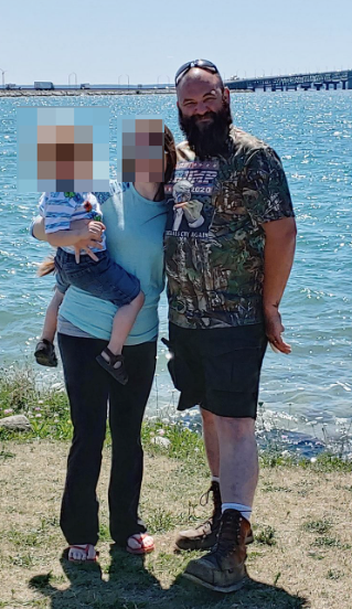 Embed - blurred photo of Michigan shooter in Trump shirt