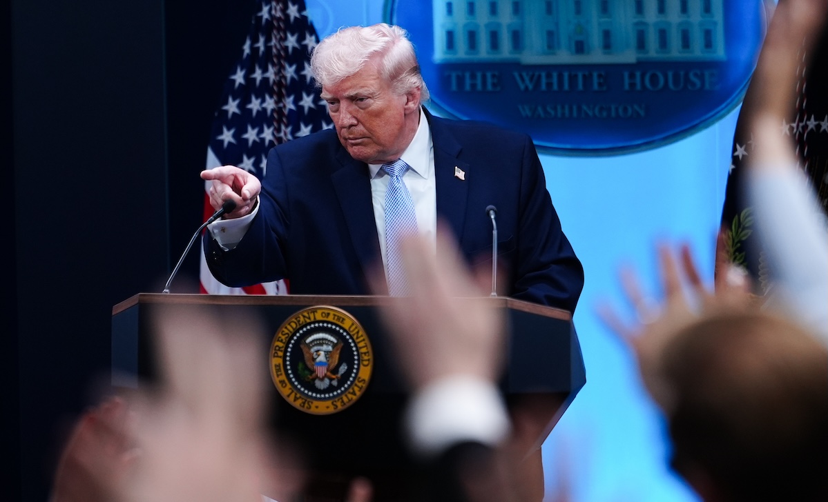 Trump press conference reporter hands in air 4-6-26