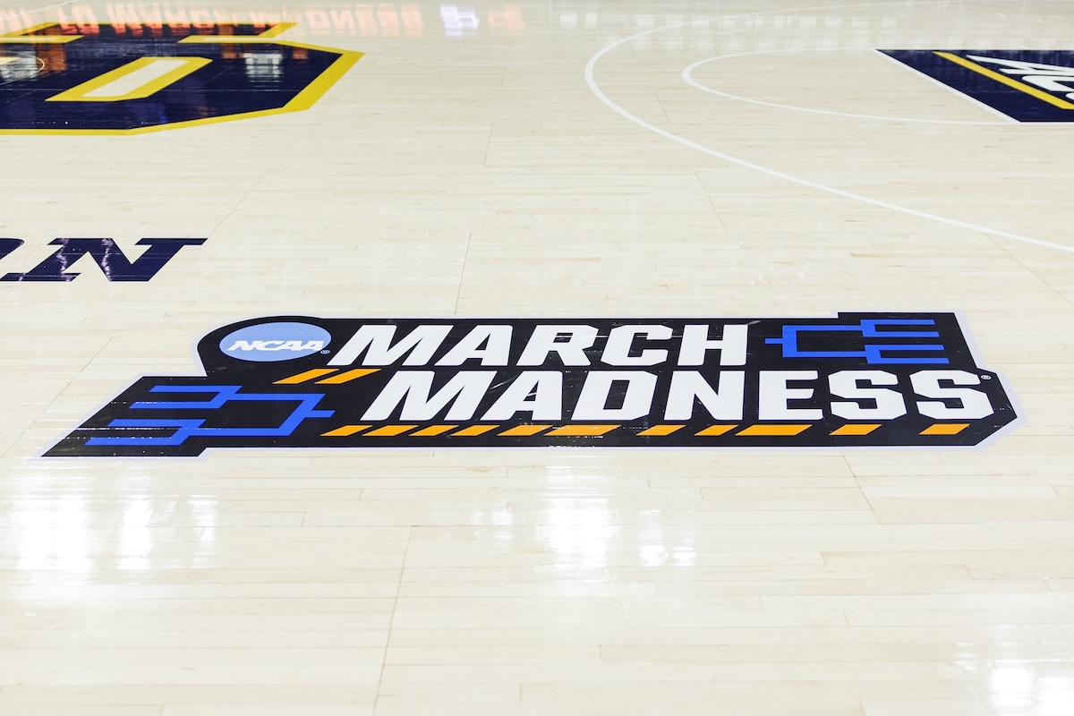 March Madness logo on the baskteball court 03-23-2025