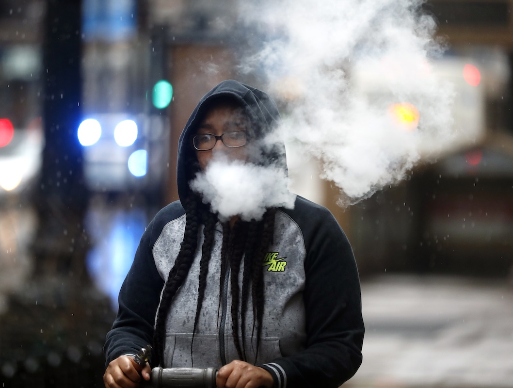 Commute exhales while using e-cigarette 03-23-2021