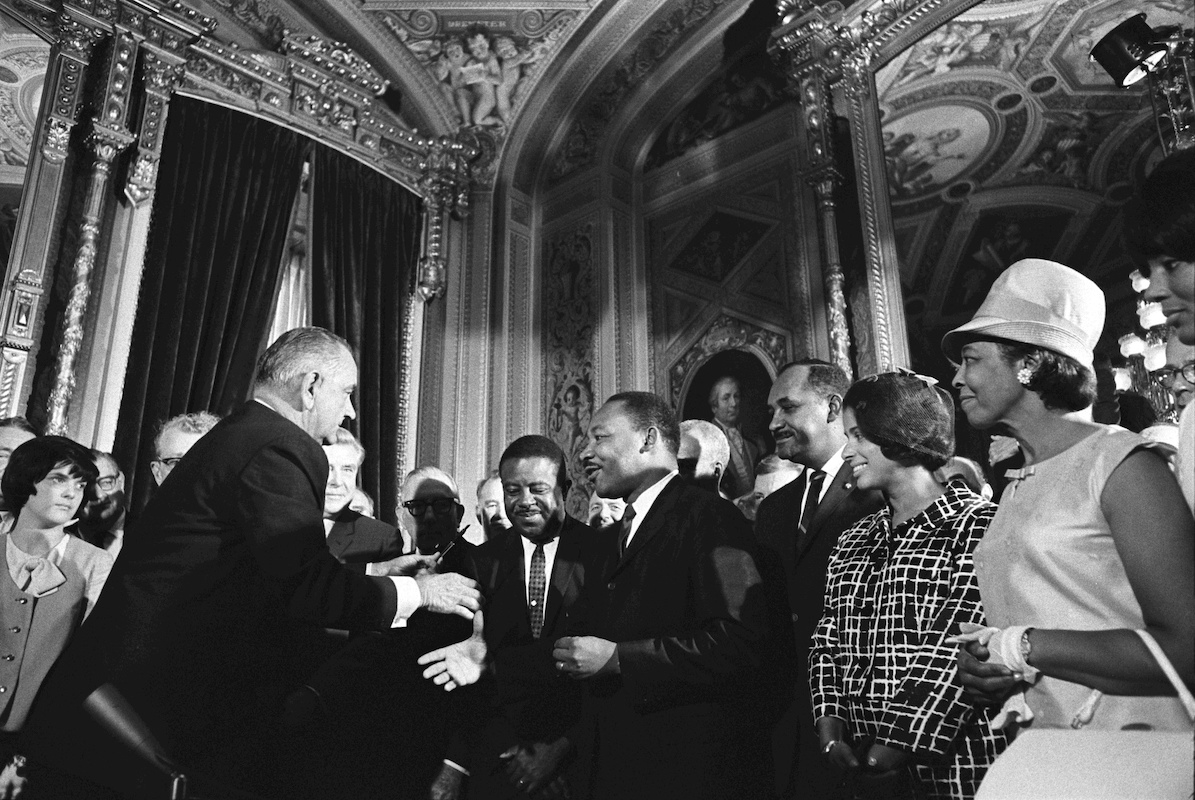 LBJ signs the VRA in 1965 w MLK Jr